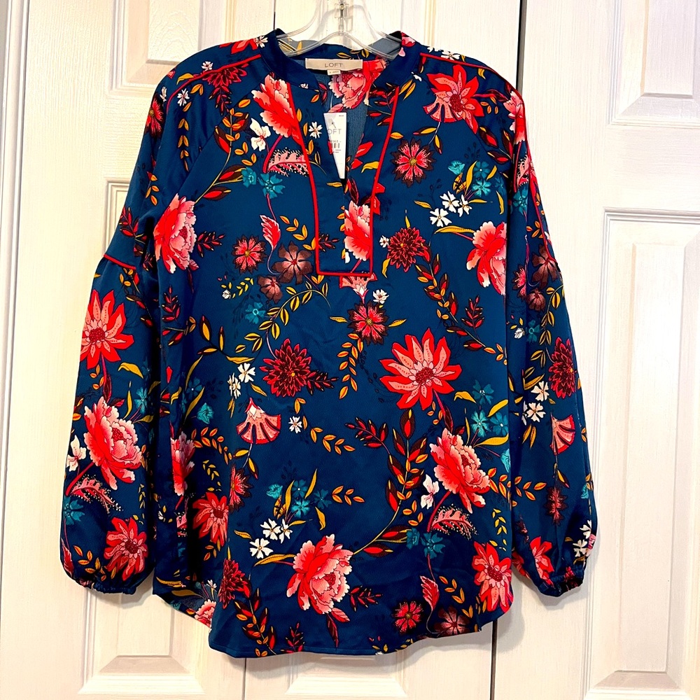 Long sleeve flower-print blouse.